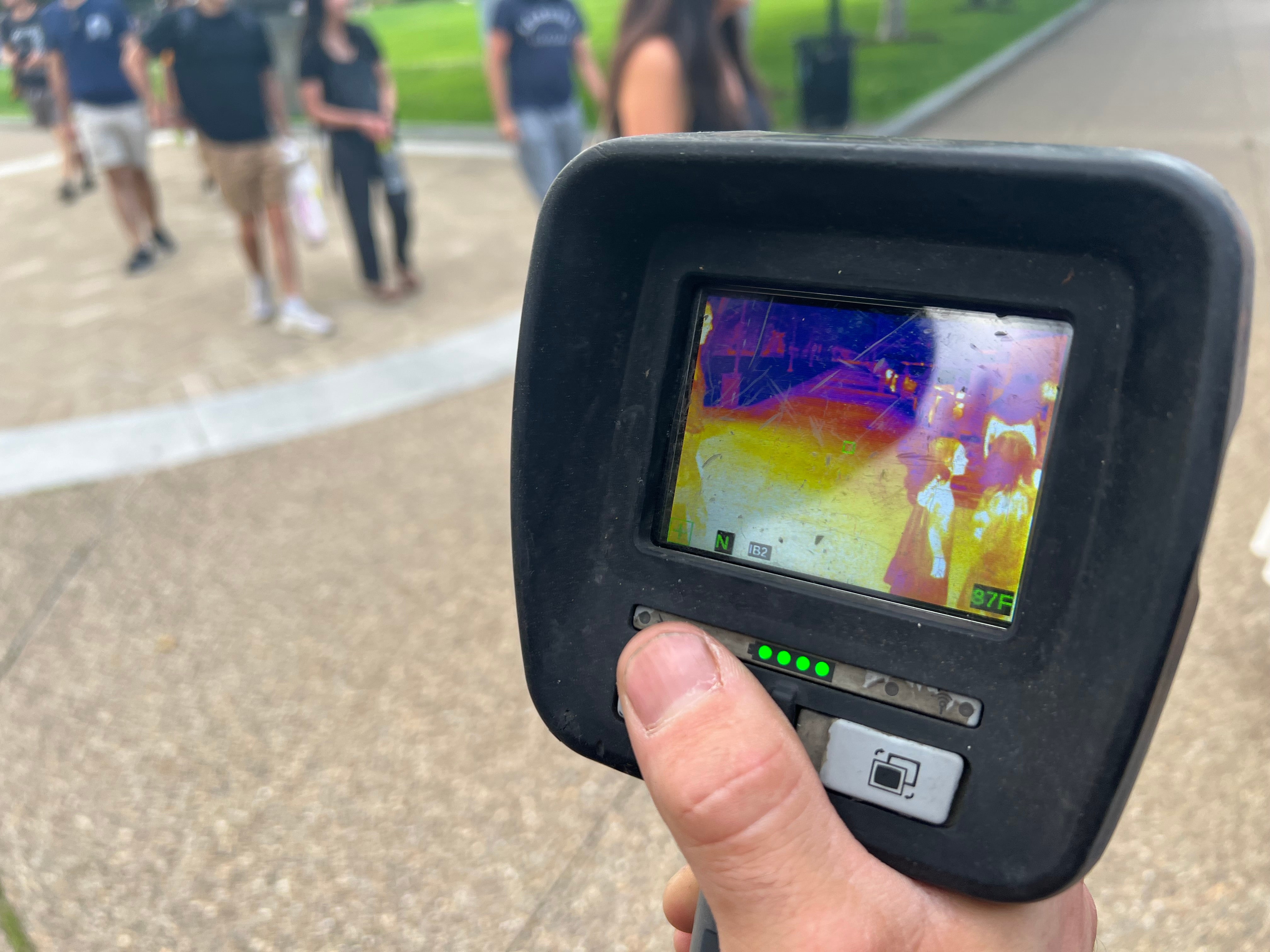 A firefighter demonstrates a thermal imager during National Night Out.