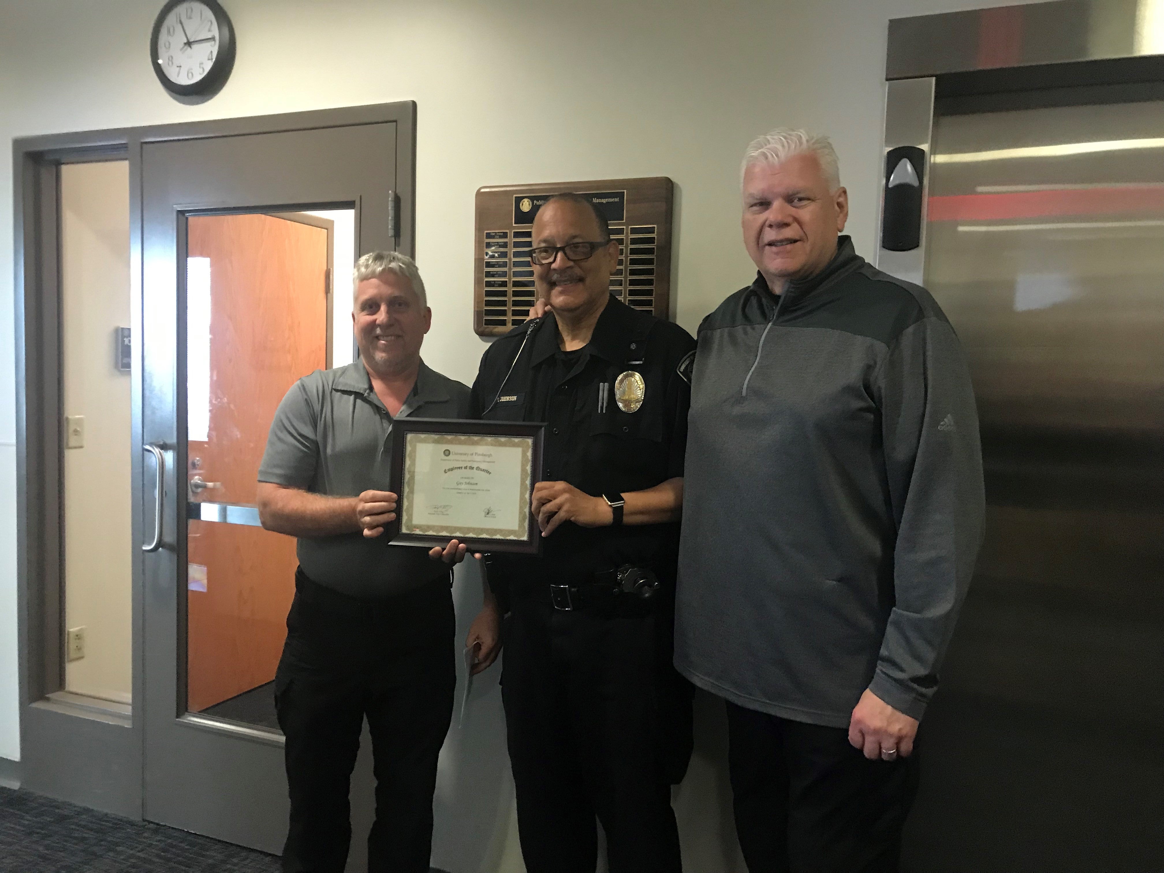 AVC Ted Fritz, Officer Guy Johnson, and Chief Loftus