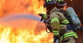 Firefighter putting out a fire