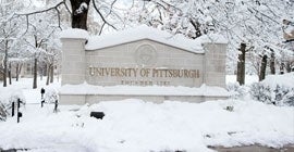Pitt sign covered in snow