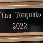 Tina Torquato's name on the Employee of the Quarter plaque